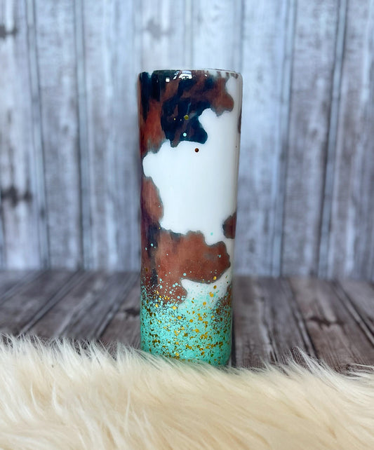 Cowhide tumbler with turquoise and gold glitter.